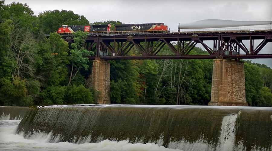 turbine parts on CN train on a bridge